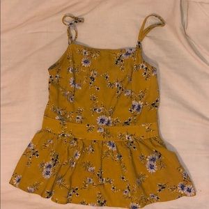 Francesca's yellow floral tank top.